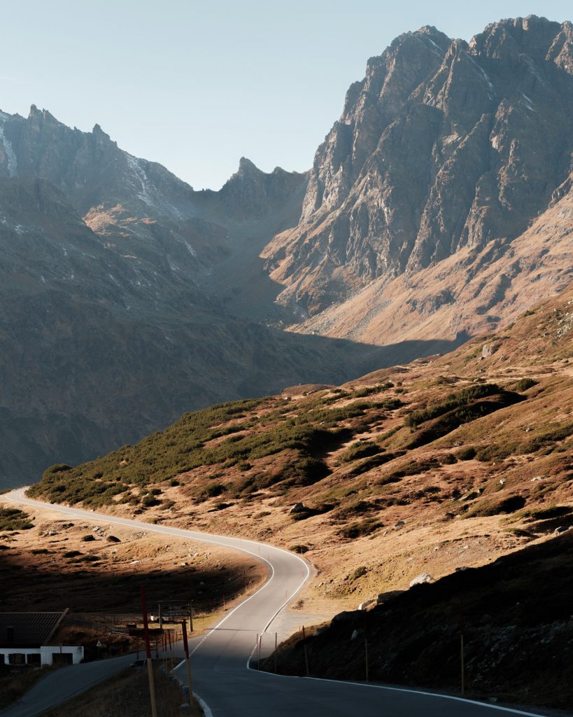 A mountain pass road in the autumn light.